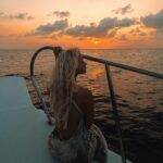 Lucie Donlan Instagram - Sailing into the sunset.. 🌊 What’s your favourite? sunset or sunrise? ☀️⬇️