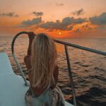 Lucie Donlan Instagram - Sailing into the sunset.. 🌊 What’s your favourite? sunset or sunrise? ☀️⬇️