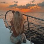 Lucie Donlan Instagram - Sailing into the sunset.. 🌊 What’s your favourite? sunset or sunrise? ☀️⬇️