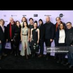 Lucy Liu Instagram - @sundanceorg Experience of a lifetime with #stevensoderbergh @dgkoepp ! An absolute dream come true to work with two giants in the industry- both continue to scale and inspire exciting new landscapes for storytelling. Together with powerhouse @sullivangrams and a trio of fresh vibrant talent @callina.liang @eddymaday @westmulholland along with unforgettable @juliafox - one can’t help but have 36 hours of laughter, chills & coffee! Also, at Sundance, a top knot and some red lipstick turn day into night in a snap🫰🤩 👗: @31philliplim 💇🏻‍♀️💄: Me! 💎: @tito_pedrini_jewellery PomPom Hat: @alysseandco @sunrisecollective.us 🎽: @normakamali 👖: @maxmara