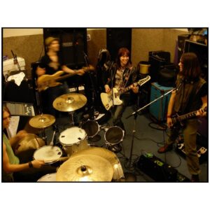 Lzzy Hale Instagram - Happy 15 years to our first album! 

Here’s 10 pics from that wild wild time in California while we did our damndest to kick start our career. 
I think we did alright. 
One day it’ll make a good chapter in a book. 
TIL then, enjoy these youthful kids with so many dreams, so much hope, so much love, and so blissfully unaware of how anything works. 
Luckily, we haven’t changed at all. 👶🏼
 💚💚💚

📸 @thejoestorm