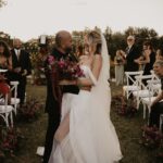 Madisson Hausburg Instagram - 10.21.21 ❤️ My wedding was literally a dream. I was 7 months pregnant with Elliot and I wouldn’t have wanted it any other way. I am so grateful for all the incredible people and vendors who made this day possible. Event planner: @oroeventco Flowers: @tailoredtwig Venue: @misionlagoestate Rentals: @gabroeventservices Photography: @paigestellutophoto Videography: @onlywavetv Accommodations: @hardrocktampa Cake: @elisespieces22 Hair: @cheyanne_hair Make up: @melissa_colletteartistry Wedding dress: @stefanienaylor Bridesmaids dresses: @mumuweddings Catering: @cblundys Music: @dj_juicy_one & @candi_theviolinist Photo booth: @posyexchange Neons: @novachrome_design_studio And a special shout-out to all our family and friends and SK film crew who joined us on this special day! Watch it all begin to unfold tonight on Siesta Key at 9pm💕