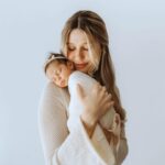 Madisson Hausburg Instagram - Happy Mother’s Day (and happy three months to Sunday)! 🩷 Three years ago on this holiday, I announced to my family that I was pregnant and we all celebrated my first Mother’s Day together. After Elliot died, Mother’s Day became a very heavy day for me. I never questioned or doubted my title of mom, but motherhood is so much more complicated and confusing without a living child to hold. Today, I am so grateful to celebrate being a mom to both of my children even if it’s not in the way I hoped…with both of my babies earthside. And although my role as mom looks drastically different now than in years past, my love for Elliot and Sunday remains as strong as ever. Sending extra love and a big hug to those whose hearts feel heavy today. To those who are missing their mothers, to those who are missing their children, and to those whose arms feel so terribly empty…I see you. You are not alone. And as always…I miss you so so very much, my sweet Elliot. Today and everyday. Thank you for making me a mom🪽