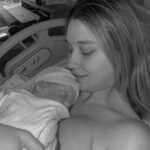 Madisson Hausburg Instagram - Happy Mother’s Day (and happy three months to Sunday)! 🩷 Three years ago on this holiday, I announced to my family that I was pregnant and we all celebrated my first Mother’s Day together. After Elliot died, Mother’s Day became a very heavy day for me. I never questioned or doubted my title of mom, but motherhood is so much more complicated and confusing without a living child to hold. Today, I am so grateful to celebrate being a mom to both of my children even if it’s not in the way I hoped…with both of my babies earthside. And although my role as mom looks drastically different now than in years past, my love for Elliot and Sunday remains as strong as ever. Sending extra love and a big hug to those whose hearts feel heavy today. To those who are missing their mothers, to those who are missing their children, and to those whose arms feel so terribly empty…I see you. You are not alone. And as always…I miss you so so very much, my sweet Elliot. Today and everyday. Thank you for making me a mom🪽