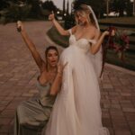 Madisson Hausburg Instagram - 10.21.21 ❤️ My wedding was literally a dream. I was 7 months pregnant with Elliot and I wouldn’t have wanted it any other way. I am so grateful for all the incredible people and vendors who made this day possible. Event planner: @oroeventco Flowers: @tailoredtwig Venue: @misionlagoestate Rentals: @gabroeventservices Photography: @paigestellutophoto Videography: @onlywavetv Accommodations: @hardrocktampa Cake: @elisespieces22 Hair: @cheyanne_hair Make up: @melissa_colletteartistry Wedding dress: @stefanienaylor Bridesmaids dresses: @mumuweddings Catering: @cblundys Music: @dj_juicy_one & @candi_theviolinist Photo booth: @posyexchange Neons: @novachrome_design_studio And a special shout-out to all our family and friends and SK film crew who joined us on this special day! Watch it all begin to unfold tonight on Siesta Key at 9pm💕