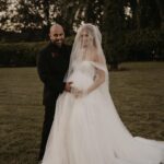 Madisson Hausburg Instagram - 10.21.21 ❤️ My wedding was literally a dream. I was 7 months pregnant with Elliot and I wouldn’t have wanted it any other way. I am so grateful for all the incredible people and vendors who made this day possible. Event planner: @oroeventco Flowers: @tailoredtwig Venue: @misionlagoestate Rentals: @gabroeventservices Photography: @paigestellutophoto Videography: @onlywavetv Accommodations: @hardrocktampa Cake: @elisespieces22 Hair: @cheyanne_hair Make up: @melissa_colletteartistry Wedding dress: @stefanienaylor Bridesmaids dresses: @mumuweddings Catering: @cblundys Music: @dj_juicy_one & @candi_theviolinist Photo booth: @posyexchange Neons: @novachrome_design_studio And a special shout-out to all our family and friends and SK film crew who joined us on this special day! Watch it all begin to unfold tonight on Siesta Key at 9pm💕