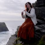 Malinda Kathleen Reese Instagram - Raglan Road on the Cliffs of Moher. Playing on a new @lirwhistle. Somehow both that metal whistle and my hands survived the freezing temperatures enough to get this tune out 🤪 filmed by @brian.ok #ireland #irish #cliffsofmoher #whistle #flute #singer #siren #reverb #live