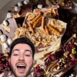Manny MUA Instagram – #The99StorePartner Call me Chef Manny 🧑🏼‍🍳 I recreated Laura’s Holiday Bark using all ingredients all from The 99 Store! How do you all think I did?! This year head to your local 99 Store for all your Holiday shopping needs because we all know we love them deals this season! @99centsonly #The99Store #99CentStoreFinds #HolidayBark