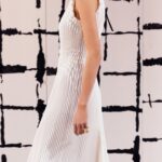 Maria Grazia Chiuri Instagram – With their ability to tame and transform textiles, shape silhouettes and control volumes, pleating and other forms of fabric manipulation play an important role throughout the new #DiorCouture Spring-Summer 2024 collection by @MariaGraziaChiuri. A white crêpe column exemplifies this type of #DiorSavoirFaire with its rows of precise pleats smocked to secure the positioning of the neckline and waist, while another draped dress is ingeniously gathered into a basketweave panel at the front. In red moiré faille, a pleated full skirt is paired with an update on the #DiorBarJacket to reinvent the original and peerless New Look icon.