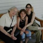 Marianne Williamson Instagram - This was my mother, Sophie Ann Williamson, and my daughter, now India More Nisbett. The picture was taken in 2001. I read recently that your children and grandchildren have a piece of their brain left in yours or something like that, I’m not sure exactly what it was. Something about brain cells being left behind. (Martha in the comments informs us it’s DNA) It makes all the sense in the world to me, actually. My feelings about my granddaughter are some love beyond “Oh isn’t she cute?” Nature has evolved over millions of years in such a way to ensure the highest possibility for survival of the species, and the fact that we’re as obsessed about our grandchildren as we were about our own children is part of that. Sophie Ann didn’t live long enough to meet India‘s daughter, Elizabeth. But my older sister was named Elizabeth and I know my mother would’ve loved that. In my mind’s eye, I see the same picture as that above but with little Elizabeth sitting on her mother’s lap. Yesterday I walked out of my apartment building and someone had done a grand sidewalk mural in front of it in colored chalk. I don’t know if it was celebrating someone’s mother or grandmother or what, but whoever she is her name is “Sophie.” On this day I remember her. The older you get, the more mysterious it all seems. Happy Mother’s Day, Mommy. You will always be that to me. 💖💜💖💜