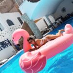 Marie Avgeropoulos Instagram - The time I tried to hold a ceremony on my big fat Greek flamingo in Santorini 🇬🇷🦩 . . . . . . . #greece #santorini #greekgirls #opa #summervibes