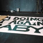 Marie Ulven Ringheim Instagram - the album title track "DOING IT AGAIN BABY" comes out on thursday march 7t!!!!!⭐️ here are some bts from the cover shoot ! this painting is 3.5 meters tall and 4.5 meters long and a part of an exhibition i’m working on;) thank you to @merzjon for painting it and to @2600hz for the design and pics by @isakuzumaki. last slide is my orignal sketch of the idea