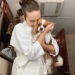 Mary Mouser Instagram - cheesin’ BTS of @cobrakaiseries season 2! do you guys remember what scene this look was from? this was my first time getting to wear the Miyagi-Do gi and I felt so freaking excited, proud, and so so grateful. my pup, Lady Charlotte, was clearly also thrilled for me (or maybe my make up just tasted good, idk 🤷🏻‍♀️)