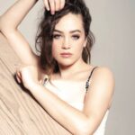 Mary Mouser Instagram - * looks like they could kill u but is actually just thinking rly hard about snackin on some cinnamon rolls * but actually, why do I want 🍦 when I look at this picture? just me? okay, cool cool. in case you didn’t know, I was the voice of Eloise (from the books about the 6 year old girl who lives at the top of the Plaza Hotel) when I was little - and the second I put on this dress for the shoot I felt like Eloise but all-grown-up. fun little throwback moment for me 💖 #rawtherfabulous . from my @bellamag.co feature Photographer: @tizianolugli Styling: @mrmontyjackson Hair: @michaelduenas Make Up: @courthart1