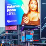 Melanie Fiona Instagram - FRIDAY NIGHT LIGHTS! 🎆🤩🎆 Y’all… @amazonmusic & @amazonmusiccan got your girl’s whole face up in Times Square in NYC & Dundas Square, in Toronto 🥹🙏🏾🥹 Thank you so much to everyone who contributed to reimagining this song in celebration of #WomensHistoryMonth and 10 Years of #TheMFLife 🎉🎉🎉💐💐💐💜 Here’s to what has been, what is, and what is yet to come. 🫶🏾 STREAM the LIVE version of L.O.V.E. - featuring @thehoneyjam ALL FEMALE choir NOW! 💥 EXCLUSIVELY ON @amazonmusic 👌🏾