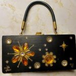 Melissa Ponzio Instagram - Once again @atlactr and #QuantumEstateSales comes thru with a purse that made me text him 10 times to greedy grab it for myself…🧡🖤🧡🖤…and for those who know #LeonardLancers #BACON #JIL