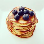 Melissa Rauch Instagram - Sunday Pancakes *That Don't Make You Feel Like You Need a Nap After: 1 cup Amaranth flour (or oat flour, quinoa flour, or any other flour you got a thing for) 1 cup Almond Flour 2 eggs beaten 1 Mashed Banana 1/2 cup unsweetened apple sauce or feel free to use sweetened if you want to be oppositional 1 tsp Vanilla extract or powder 2 tbsp. coconut oil 1/2 cup almond milk (or coconut milk, oat milk, milk-milk, pea milk, broccoli milk...okay, broccoli milk doesn't exist...YET. No one ever heard of pea milk 10 years ago...so maybe I'm just ahead of my f'in time, Suckas!) I've also thrown some leftover sweet potatoes in if I have them on hand, but I'm not going to go out of my way to roast a root vegetable on a Sunday morning if I don't already have them made. And when I say I have "thrown" it in, I don't mean I just threw a whole g-damn yam in there, I mashed it up first! Ug! Now that that's clarified, mix everything together. Get out a skillet (or a frying pan, but saying "skillet" makes me feel like this is the olden days where I feel my true self really belongs). Or if you have a griddle, use that. And good for you on the griddle. You're living your best life. Put some grease on griddle/skillet. I like to use ghee because I think it makes my house smell like sugar cookies. Yes, I could just buy a sugar cookie scented candle and I just might okay?! But right now, I'm gheeing my skillet, so HOLD ON!! You can also use oil, regular butter or some sort of cooking spray. Turn on the stove to medium heat or high heat if you're impatient and don't mind a rush job that may result in a burned pancake that isn't fully cooked on the inside. Your! Choice! Pour the batter in skillet per whatever size pancake makes you happy. Flip em when ready to be flipped. Or do it too soon like I usually do and end up with a glob of half cooked batter. Put them on a plate when ready. Top them with your topping of choice. I like blueberries, but you don't need to copy me all the time. Be your own person for heavens sake...you are the best you there is! Unless you believe in cloning-in which case, you may be a mediocre you or the worst you. Hard to know. Enjoy! #glutenfreerecipes #pancakes