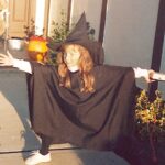 Melissa Rauch Instagram - #TBT to the year I decided to stand outside with a cassette tape of monster sounds playing on a tape player connected to an old intercom (used as a speaker) to welcome/scare trick or treaters...of which we had four - if that. Also worth mentioning, I ran out of green makeup since I did a bunch of test runs earlier in the week...which accounts for the blotches. And, I’d like to note that this witch still enjoys a sensible sneaker. #happyhalloween 🧡🎃🖤🎃🧡
