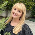 Melissa Rauch Instagram – I put on a dress with pockets and had such a lovely time talking #NightCourt with some really wonderful people the other day. @nbc 

❤ and thanks to:
Styling: @hayley_atkin_ 
Hair: @eddie_cook 
Makeup: @tobyfleischman 
Awesome dress with said pockets: @tedbaker 
Non-manicured hand hideout: Dose Pockets!