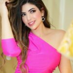 Merna Gamel Instagram - Always look on the PINK side of life 🎀🪄 Photographer @kisho_abubakr Dress @armaniexchange Clutch @alexandermcqueen Styled @sandragamil1 @palazzoversacedubai