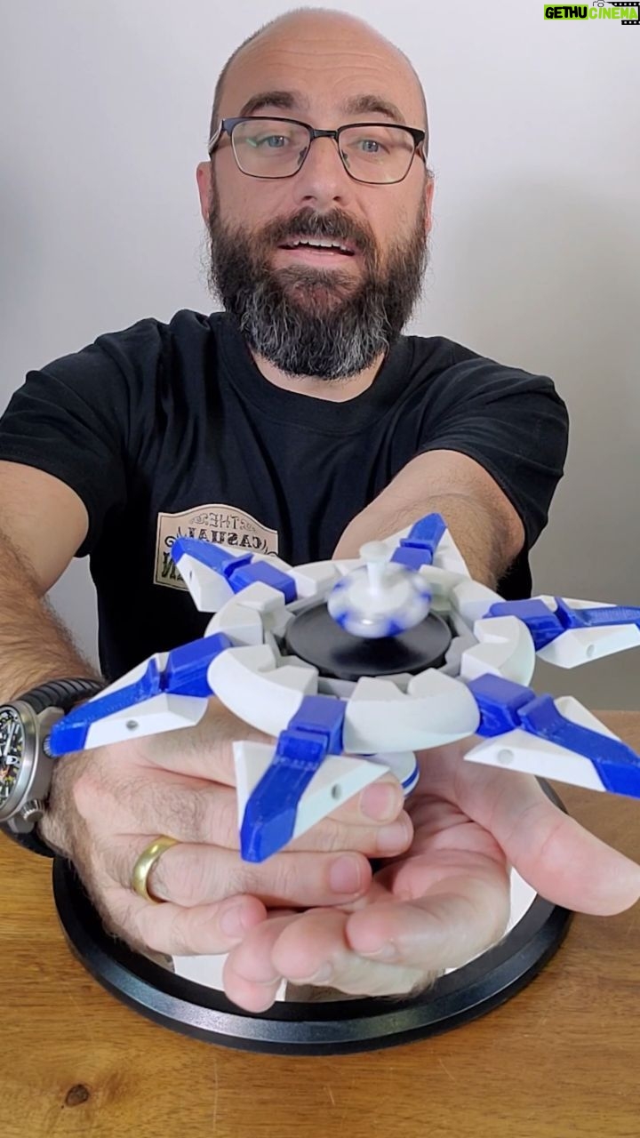 Michael Stevens Instagram - This beautiful specimen was built and invented by Lee Krasnow @pacificpuzzleworks Look for my "The Topsy Turvy Top" video on dingsauce on YouTube to learn more about it and how it works!! #physics #toy #physicstoy #spinning #puzzle #gyroscope #stem #stemtoy