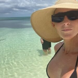 Michelle Leigh Calaway Instagram - I was simply enjoying a book on the beach when this “vegetation” looked a lot like a shark…..so I text hubby @undertaker 🦈😳kinda digging that last picture …A LOT😍#myprotector 🖤