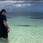 Michelle Leigh Calaway Instagram – I was simply enjoying a book on the beach when this “vegetation” looked a lot like a shark…..so I text hubby @undertaker 🦈😳kinda digging that last picture …A LOT😍#myprotector 🖤