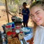 Michelle Monaghan Instagram - I was touched to get to spend time with the people of Cambodia. Their warmth and kindness was deeply felt. Although it was a quick trip, it was long enough to be reminded of the beauty of the human spirit and frankly, how far a smile and a kind gesture can go. And I had so much fun! Wishing you all a beautiful Sunday. ✨ (These photos were taken by me and with permission by all. Thank you for allowing me to capture your daily life) 1.Receiving a beautiful blessing from the local monk. 2 Native to Siem Reap, this specific chant was in Hindu and Sanskrit so perhaps I’m doubly blessed now ;) 3 Loaded with love 4 Sweet or salty smoked fish 5 Silk worms, crickets and peanuts. Don’t knock til you try it! 😋 6 Meet The Chef! His specialty - shrimp fritters! 7 My tuk-tuk but make it cute 8 A boy and a bike. 9 My friend and wonderful guide Lee @chhvn1y_chhorn 10 My cup runneth over.