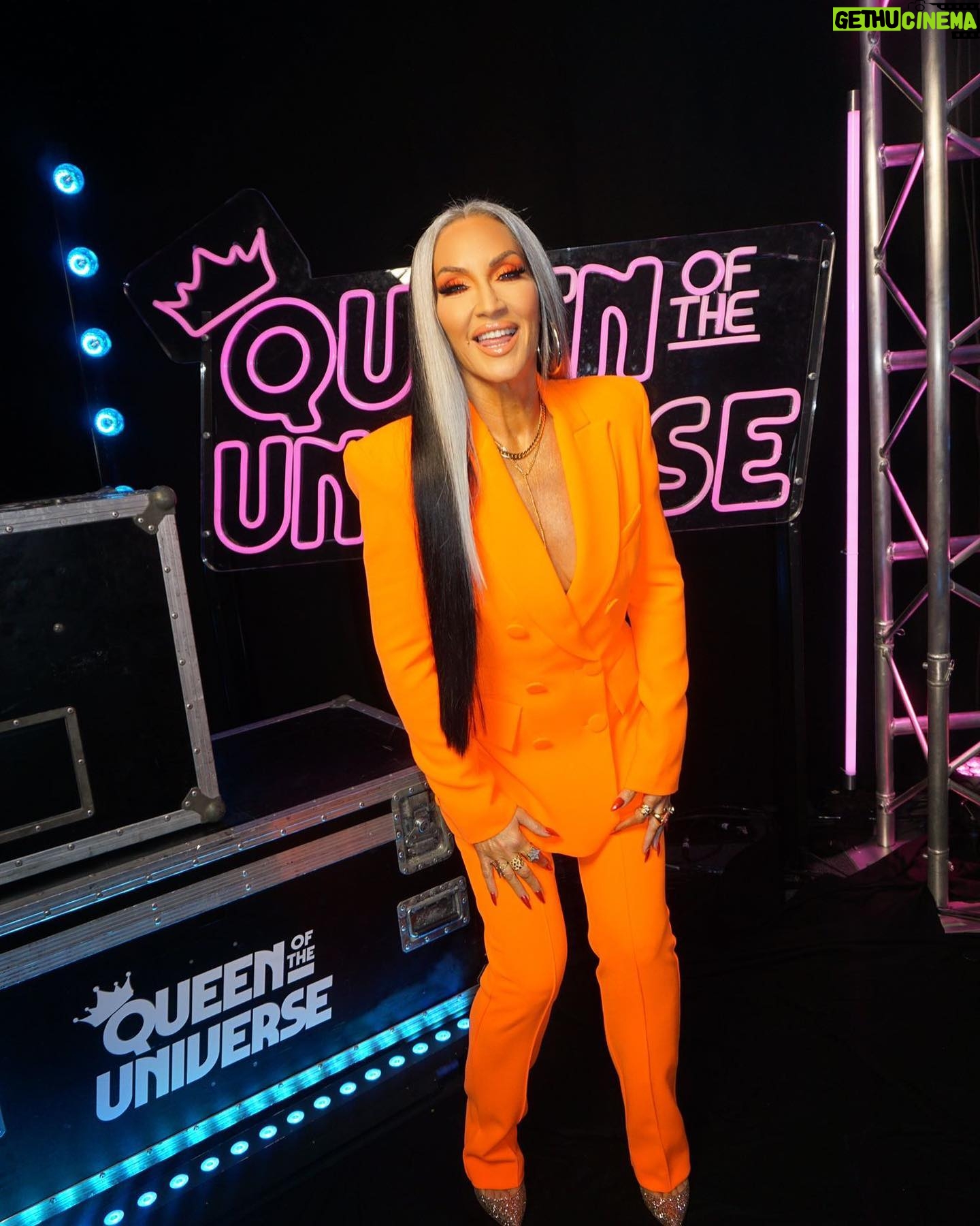 Michelle Visage Instagram - Two fabulous queens, one song! ππ Donβt miss an all-new #QueenOfTheUniverse NOW STREAMING on @paramountplus! β¨ Hair @haircraigmarsden Paint @samglamuk Style @laurysmith Suit @alexperryofficial Necklace @chlobojewellery Shoes @louboutinworld Glow @teresaboyd_tanning using @siennaxofficial