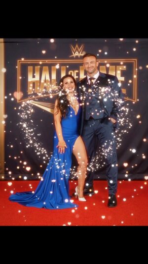 Mickie James Instagram - No place is rather be than by your side. Had to represent the #1 GM for the #1 show in sports entertainment because everything is better in blue. 💙 Congratulations to all the inductees. What an incredible night?! I was honored to be there with so many friends and legends. And big Congratulations to my hubby  @nickaldis on your very 1st Wrestlemania . I love to see you finally shine where you have always belonged. I love you! 

Suit: @nasir_suits 
Dress: @adolfocanaca 
Styled by @aristidesfashion 
#Her Ring @headlinebymm @mckenzienmitchell 

#wwe #halloffame #wrestlemania #wwehof #redcarpet #redcarpetfashion