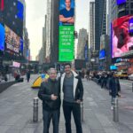 Mikhail Varshavski Instagram - An incredible moment to share with my father in #timessquare being able to support science 🙏🏼❤️ We walked through Times Square 20 years ago during our first days as immigrants and now we both proudly walk as licensed doctors and I owe all of that to him! @covidvxproject #ᴠaccinessavelives #happybdaypappa