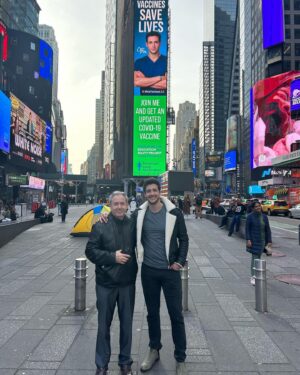 Mikhail Varshavski Instagram - An incredible moment to share with my father in #timessquare being able to support science 🙏🏼❤️

We walked through Times Square 20  years ago during our first days as immigrants and now we both proudly walk as licensed doctors and I owe all of that to him! @covidvxproject #ᴠaccinessavelives #happybdaypappa