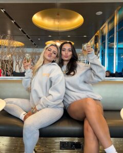 Millie Court Instagram - Besties who travel together and wear matching @whitefoxboutique hoodies 😉✨ let’s gooooo 🇺🇸 Oh and matching dirty old passports 😅 ad Use code MILLIEGRACE or CHLOEB for 30% discount off the website 🫶🏼