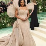 Mindy Kaling Instagram – The name of my gown was “The Melting Flower of Time”. I was so honored to wear the genius @gauravguptaofficial to the Met Gala this year. The cape was inspired by a blooming flower, and his signature sculptural techniques evoked the passage of time. Thank you Gaurav, @voguemagazine and the team of artists who designed my look! 🤍🤍🤍 
📸: @gettyentertainment