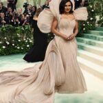 Mindy Kaling Instagram – The name of my gown was “The Melting Flower of Time”. I was so honored to wear the genius @gauravguptaofficial to the Met Gala this year. The cape was inspired by a blooming flower, and his signature sculptural techniques evoked the passage of time. Thank you Gaurav, @voguemagazine and the team of artists who designed my look! 🤍🤍🤍
📸: @gettyentertainment