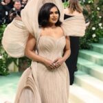 Mindy Kaling Instagram – The name of my gown was “The Melting Flower of Time”. I was so honored to wear the genius @gauravguptaofficial to the Met Gala this year. The cape was inspired by a blooming flower, and his signature sculptural techniques evoked the passage of time. Thank you Gaurav, @voguemagazine and the team of artists who designed my look! 🤍🤍🤍 
📸: @gettyentertainment
