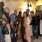 Ming-Na Wen Instagram - Like my twin?😂😂 Okay. Why do I have a LIFE-SIZE bronze statue of me as Fennec Shand? Well, my amazing husband started the process last April of having one made to celebrate my birthday. It was carved from clay from just a photo as reference. The artistry and accuracy is remarkable. Several revisions took place. (Thank you, @mitchelwuphotography & @jenchiwu for your input.🥰) This was all done in secrecy. Unfortunately, it didn't arrive in time for my birthday last November. It just arrived last week. When we had a couples night with some of our dearest friends we've known for over 20 years, Eric unveiled it. What a tremendous surprise! We were all in awe! He knows how much #starwars means to me; how being Fennec has been a childhood's dream come true for me. So he wanted to celebrate my birthday with something unique and BIG! He succeeded!! At first, I was utterly astounded and amused. I also thought he was crazy! Where the hell were we going to put it? She couldn't be outside scaring people! Once we moved her inside, she actually fits great in our media room. She's home! I love bronzed Fennec more and more, just like my love for this marvelous man. She's a daily reminder of how lucky I am to have such a thoughtful and loving husband. He's the best! Thank you, babe! I love you, always. ❤️🥰 #thisistheway #fennecshand #themandalorian #thebookofbobafett #starwars