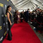 Ming-Na Wen Instagram - I LOVE this look!! See the slight homage to Fennec Shand?🖤🧡 🤘🏼 We definitely rocked and rolled yesterday to get this look onto the @saturnawards red carpet yesterday! After an all day at #megaconorlando Sat, I flew back very early yesterday morning and my glam squad whipped a super jetlagged and sleep-deprived MamaMing into shape. Love and endless thanks to @suzannaqface and @hair.by.shaysanfordfong for giving me face & hair glam. Thank you @laurendemiranda for all your help, especially in assisting me in the ladies' room when I needed to get in and out of this jumper to pee!😂 Soooo glamorous!!😂😂