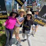 Ming-Na Wen Instagram - SagAftra Sisters with Signs & Straw-hats on Strike! 👒🪧👊🏼🥰❤️ Picketing with @laurentom9000, @thetamlyntomita & hubby @ericmichaelzee.❤️🥰 It was a hot day☀️🔥, but that did not deter us and several thousands of our @sagaftra & @wga members from marching today! #strongertogether #fairwages4all #sagaftra #sagaftrastrike #wga #strike #protectionfromAI #safeworkingconditions