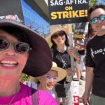 Ming-Na Wen Instagram - SagAftra Sisters with Signs & Straw-hats on Strike! 👒🪧👊🏼🥰❤️ Picketing with @laurentom9000, @thetamlyntomita & hubby @ericmichaelzee.❤️🥰 It was a hot day☀️🔥, but that did not deter us and several thousands of our @sagaftra & @wga members from marching today! #strongertogether #fairwages4all #sagaftra #sagaftrastrike #wga #strike #protectionfromAI #safeworkingconditions