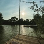Miranda Hart Instagram – My little toes and I loved the setting sun on the lake @ditchlingcabin 
I don’t promote stuff much on social media except @themirandashop and the charities the shop supports, but I am so passionate about people taking the chance to rest and play, recharge, just look at the wonder and beauty of nature, that I have to share about this cabin.  I came here for my 50th in December and had to see it in the summer.  It’s in Sussex yet you feel you could be somewhere other. 
If you are lucky enough to get the chance I highly recommend.  Stay tuned for a discount code the owners are being kind enough to let my ‘followers’ use for bookings next year. 🌲❤️🌲