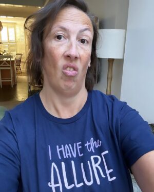Miranda Hart Instagram - Sometimes, when my life and job involves posing in a t-shirt that states my ‘allure’ because it’s part of a comedy creation thingy I do, that can jar when you hold acute awareness of suffering in the same world. 
But I decided that the worst thing we can do is stop doing the things we do. Because not everyone can be on the frontline and we all have skills that the world needs and I suppose sometimes we just have to think about making our little patch of the world a fraction better for whatever silly or seemingly meaningless way. 
So here is me, my allure and my t-shirt from @themirandashop where I create some fun and cosy things that may help one or ten of you feel better. And remember you too have the allure!!! 🧡🧡