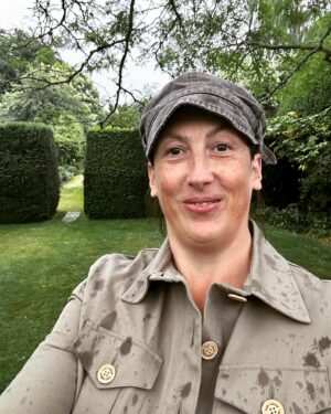 Miranda Hart Instagram - She’s smiling in the rain. 
She’s talking about herself in the third person. 
She’s wearing a new jacket that makes her feel like a cross between a gardener, a landgirl and Indiana Jones. 
 Important details of why I share here:-

British outerwear brand @TROYLondonUK has teamed up with @CountrysideFund by releasing a selection of their best-selling Tracker Jackets individually embroidered with The Prince’s Countryside Fund logo and donating £50 from each sale to the charity through the summer. These 100% cotton jackets are a great summer layer for those looking to support the vital work of the PCF to support farming businesses, rural enterprises, and provide training opportunities for young people.
