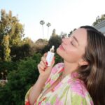 Miranda Kerr Instagram – It’s finally here!!! After 5 years of testing and perfecting our formula, I am sooo excited to introduce @koraorganics NEW Silky Sun Drops ✨☀️💛 This SPF 30 sunscreen serum not only protects from harmful rays, but also primes the skin, reduces redness and gives a silky smooth finish with no white cast. I am obsessed and I can’t believe I finally get to share it with all of you! Available now on koraorganics.com   dropping in @sephora US on 5/13