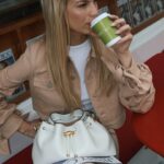 Nadine Leopold Instagram - My birthstone is a coffee bean 😋 Newsstand Pop Up by @jimmychoo 🗞️☕️