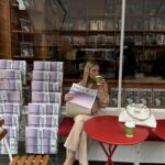 Nadine Leopold Instagram - My birthstone is a coffee bean 😋 Newsstand Pop Up by @jimmychoo 🗞️☕️
