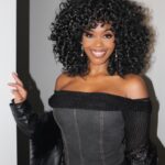 Nafessa Williams Instagram – Wore this outfit but didn’t get any pics, so I’m running it back with different hair! Y’all like this look with the curly hair or the pony?! 

Btw that’s my beautiful Grandmom/angel. It took me almost 20 years to put a big picture of her in my house and I’m so happy I did. We talk ALL the time. I be like gurrrl, let me tell you what happened ta-day! 😎😇

Thank you for my purse @jcrew 

Pics @rockijean