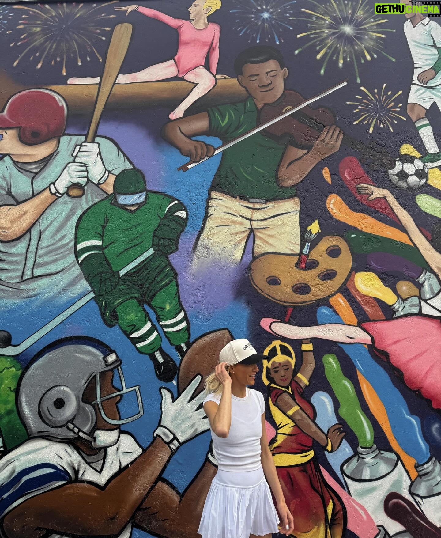 Nastia Liukin Instagram - Spent the day wandering around Frisco after the @wogagymnastics Classic/Liukin Invitational and had SO much fun. This city is rich and vibrant, and I’m so proud of the incredible destination that it has become. Sharing my ideal itinerary for a trip to Frisco below (and in Stories) if you’re ever in town! @visitfriscotx STAY: @omnifriscothestar or @omnipgafriscoresort DO: make a hat at @fleastyle at @thestarinfrisco, play a round @officialpgafrisco, catch me (!!) on the Frisco Past and Present Mural in The Rail District along with so many incredible small businesses, and relax at the Mokara spa @omnipgafriscoresort EAT: room service breakfast @omnifriscothestar, lunch @trufirekitchenandbar, drinks @trickriderfrisco, dinner @heritagetable