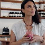 Nathalie Kelley Instagram – Do you put a lot of thought into which plant-based milk to buy? I do. See, the almond industry guzzles up an enormous amount of water and those monocultures are really bad for the bees!  Soy monocultures are driving deforestation in the Amazon and most cashews on the market have been linked to slave-like labor conditions in Vietnam. Enter Bamnut! @Whatiffoods Bambara groundnut is an ancient regenerative miracle crop that can grow in poor soil conditions and arid climates without needing fertilizers or pesticides. 
Growing this crop requires very little water plus it’s long roots help fix nitrogen in the soil so its a vital part of soil restoration. This yummy supernut is also packed with plant-based protein containing all 9 amino-acids, low calorie carbs, prebiotic fibres, vitamins & minerals, healthy fats.
It’s a plant based milk that’s super healthy and nutritious for you AND the soil!
Find @whatiffoods BamNut milk at @sprouts stores nationwide in the US or order online! 🌈 shout out to @orchardstlove for their amazing tremella mushroom powder and letting me play in their kitchen lab to concoct this yummy recipe. And @estiloemporio for the yummiest linen threads. 🫶🏽