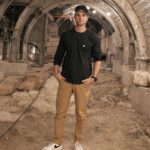 Nathaniel Buzolic Instagram - At the @cityofdavid you can visit what is known as the pilgrims road. This Jerusalem road which was uncovered by archaeologists is said to have been used by Jewish pilgrims obeying the biblical commandment to travel to Jeruslaem three times a year for a temple sacrifice - Passover, Shavuot (Pentecost) and succoth (feast of tabernacles) For Jews the final stages of they long journeys would begin at the pool of Siloam a giant mikveh (ritual pool) where a cleansing and preparation would be practiced before heading to the Temple Mount. This is the same pool Jesus instructed the blind man to Go and wash the mud of His eyes to regain his site in John’s Gospel. Does Jesus meet this man on this road? According to the gospel account we known Jesus has just left the Temple Grounds before this powerful encounter. Does Jesus instruct a blind man to go the opposite direction of the crowds making there way to the temple so he can be healed. It seems so. Either way I am standing on a road that Jesus himself would have travelled along and used. And also the same road that this blind man most likely travelled down to finally see. The evidence here also suggestions that Along this road Judean locals would have had shops to trade with all those making their way to the temple. The historian Josephus says 2,000 ago, on the pilgrimage festivals, there would have been more than 2 million people going up on pilgrimage. This road and the pool of Siloam were hidden for almost 2,000 years. 2,000 years! Forgotten underground. Hidden from our sight. But today we can see them and have even more confidence in the events told in the Bible and the gospels of Jesus the messiah. @palmsundaysco is also back - so if you would like to grab a beanie for yourself or a friend order today and it’s ships next working day!